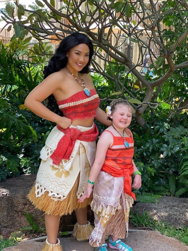 Young girl posing with Moana 